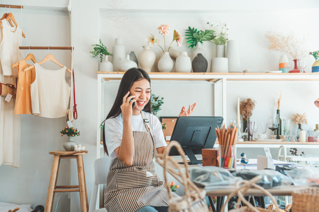 small business owner talking on the phone with cus utc